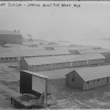 <p>Temporary barracks and an outdoor movie screen were built on the drill field during the First World War to accommodate the crush of recruits passing through Fort Slocum. View to northeast, ca. 1918 (Library of Congress, Prints &amp; Photos Div, GG Bain digital collection).</p>